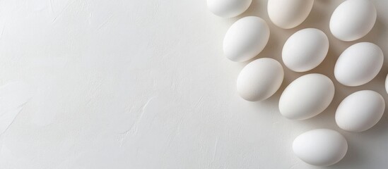 Fototapete - Fresh white cage free eggs on a white background with copy space
