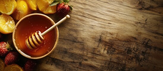 Leinwandbilder - Bowl of honey dipper and fruits on a wooden surface with space for text. with copy space image. Place for adding text or design