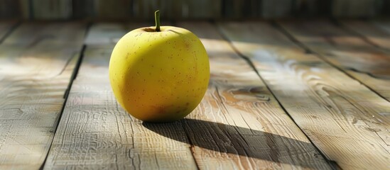 Leinwandbilder - Yellow apple resting on a wooden surface. with copy space image. Place for adding text or design