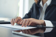 © tippapatt - Close up, business woman working on computer at modern office. Businesswoman hand typing on computer keyboard, online working, surfing the internet with digital tablet on office table.