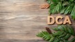© Pixelbiz - DCA wooden block concept. A rustic wooden background features the letters 'DCA' surrounded by green foliage and pinecones, creating a natural, earthy aesthetic.