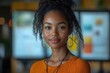 © julija - dynamic young african american female tech entrepreneur presenting innovative startup ideas in modern co-working space with digital displays