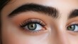 © Andrii - Stunning Female Eyes With Long Lashes In Close-Up During An Eyelash Extension Procedure. A Glimpse Into Beauty Enhancement.