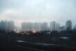 © Moon - A foggy cityscape viewed through the window of a moving train, symbolizing the overwhelming and disorienting pace of life and the difficulty of navigating emotional challenges.