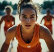 © anatolii - Intense young female athletes preparing for a basketball drill during a sunny afternoon practice session outdoors in a sports complex