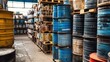 © Giovanni - Storage of hazardous chemical waste in metal drums within an industrial facility showcasing proper safety measures and organization.