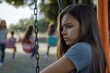 © Ева Поликарпова - A young girl sits on a swing in a sunny park, with a carefree expression