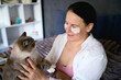 © Victoria Antre - a senior woman in underwear on the bed performs routine self-care with face and body cosmetics