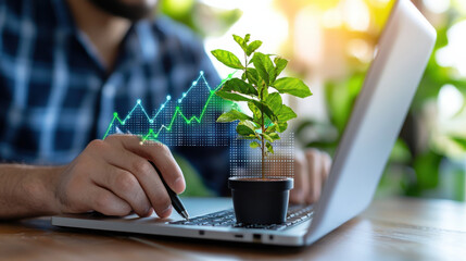 Aufkleber - close up of analyst working on laptop with small plant, symbolizing green economy growth and sustainability. digital graph overlay represents data analysis