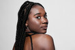 © SHOTPRIME STUDIO - Portrait of a confident Black woman with braided hair, showcasing beauty and elegance against a clean white background, perfect for empowerment and diversity concepts
