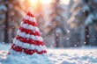 © Prapasarabhron - White and red striped isolated Christmas tree in a snowy environment, winter, red