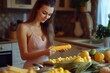 © Ева Поликарпова - A woman prepares food in her kitchen with fresh corn on the cob