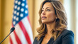 © Elen Moulin - Woman government official delivers speech with passion as the American flag stands tall in the background during an important press conference
