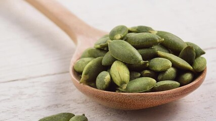 Poster - Pumpkin seeds in a wooden spoon