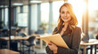 © PixelPulse AI - A smiling woman in a gray suit holds a folder in a sunlit office