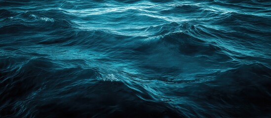 Wall Mural - dark ocean water surface with aqua waves and space for text in a tranquil abstract background