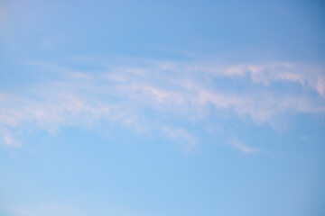 Wall Mural - a beautiful sky tinted by the sun leaving vibrant shades of gold, pink, blue and multicolored. cloud