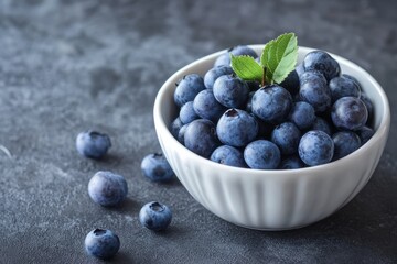 Wall Mural - Close up of fresh ripe blueberries picked in white bowl with space for text