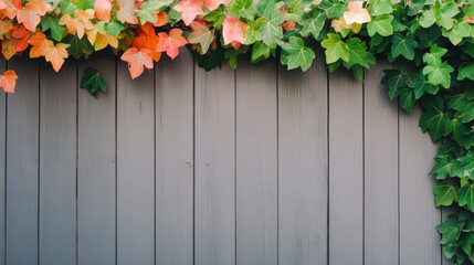 Canvas Print - A vibrant display of colorful leaves cascading over a rustic wooden fence creates a serene backdrop, perfect for nature-themed projects, home decor, or seasonal promotions,