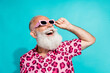 © deagreez - Photo of handsome bearded grandpa excited look empty space dressed stylish pink leopard print garment isolated on cyan color background