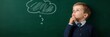 © olga_demina - Pensive schoolboy contemplating a solution or idea, depicted by a thought bubble drawn on a chalkboard, symbolizing the process of learning and problem solving in education