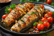 © RISHAD - Grilled zucchini with cherry tomatoes and herbs on black plate