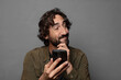 © kues1 - young bearded man using a smartphone