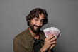 © kues1 - young bearded man with bank notes bills