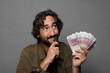 © kues1 - young bearded man with bank notes bills
