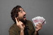 © kues1 - young bearded man with bank notes bills