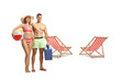 © Ljupco Smokovski - Young couple in swimming suits standing near beach chairs
