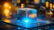 © pattaphorn - Futuristic Transparent Cube with Glowing Blue Light on Circuit Board, Representing Advanced Technology and Innovation in Digital Landscape