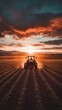 © Arx PhotoStock - Tractor Plowing Fields at Sunset - Agricultural Scene with Mountains