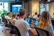 © PinkiePie - A group of people of various ages taking a coding bootcamp in a modern office