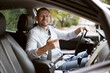 © New Africa - Man driving modern car, view through window