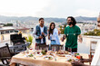 © Xavier Lorenzo - Multiracial friends having fun together drinking and dancing at summer party on rooftop terrace