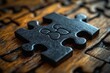 © k - Black and White Puzzle Pieces Fitting Together on Wooden Background as Unity Between Opposites