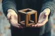 © video - Man Holding Wooden Optical Illusion Cube in Surrealistic Style with Warm Lighting