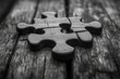 © k - Black and White Puzzle Piece on Rustic Wood Table as a Unity Concept between Opposites