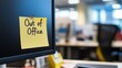 © Atmospheric stock - Yellow sticky note displaying 'out of office' on computer screen in workplace setting