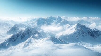 Wall Mural - Majestic snow-capped mountain peaks under clear blue sky in serene winter landscape