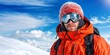 © KENZOGROW - Perseverance meets challenge with mindset. A mountaineer in an orange jacket with goggles against a snowy backdrop and blue sky.