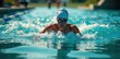 © retirementfun - Swimmer in the water with a bike and run gear on side, , sporty lifestyle