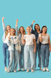 © Pixel-Shot - Portrait of happy women on blue background