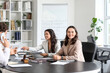 © Pixel-Shot - Female lawyers working at table in office