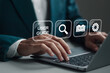© Pakin - Businessman using laptop with virtual user guide icon for business service. User manual guide, Online instruction manual and strategy advice.