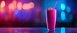 © ธนากร บัวพรหม - Vibrant pink smoothie in a glass with a straw, set against a colorful blurred background, perfect for summer refreshment.
