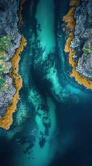 Wall Mural - Aerial Turquoise channel flows between rocky coastline, algae blooms, ocean.