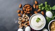 © ChrisTYCat - Flat lay arrangement of high protein nutrient dense snacks including boiled eggs Greek yogurt and mixed nuts  Healthy clean eating concept for fitness nutrition and wellness