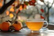 © NASH - Korean persimmon tea in a transparent cup viewed from the side with selective focus